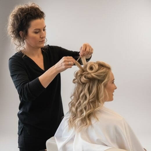Girl having her hair done by a Foriu Pro for a social event in Los Angeles, available for home service